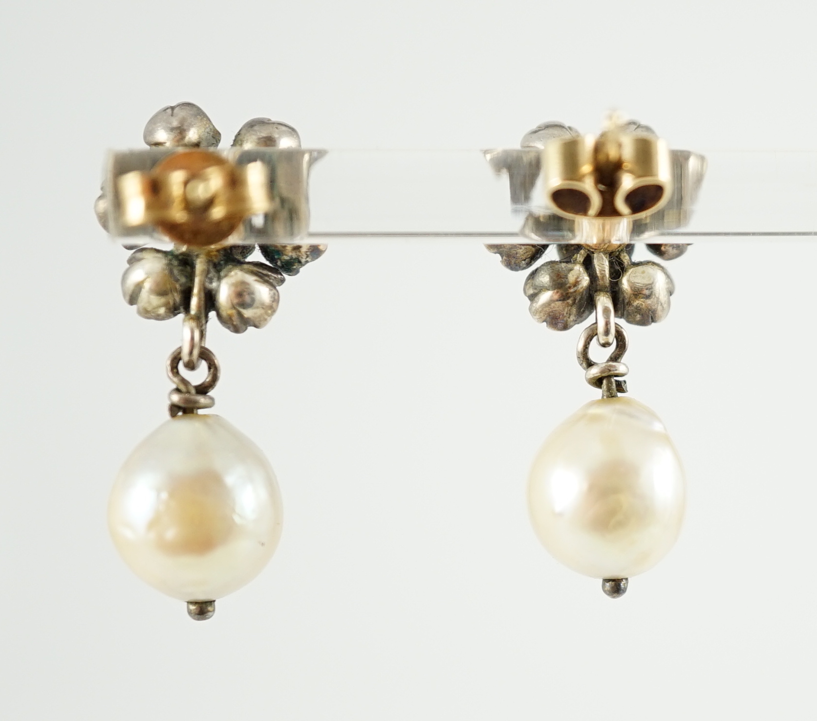 A pair of early 19th century silver, rose cut diamond and baroque pearl set drop earrings